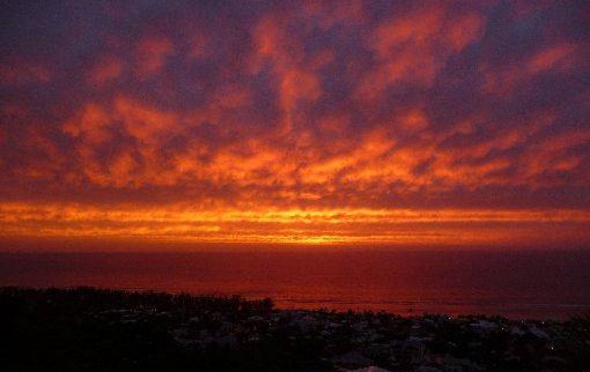 Location de vacances - Chalet à Saint-Leu - coucher de soleil vue de la veranda