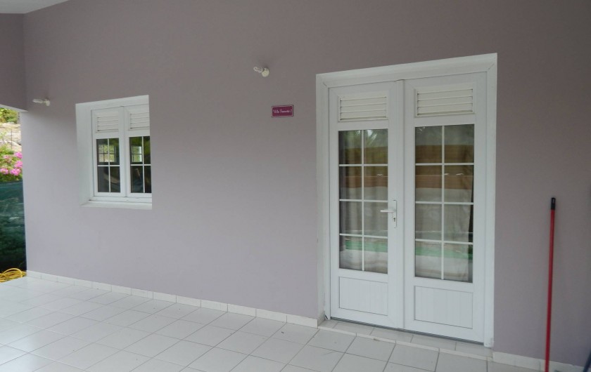 Location de vacances - Villa à Sainte-Anne - véranda appartement 2