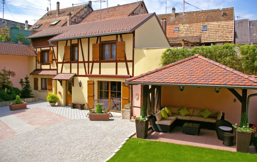 Location de vacances - Chambre d'hôtes à Beblenheim - Le Clos des raisins chambres d'hôtes de charme en Alsace vue du jardin