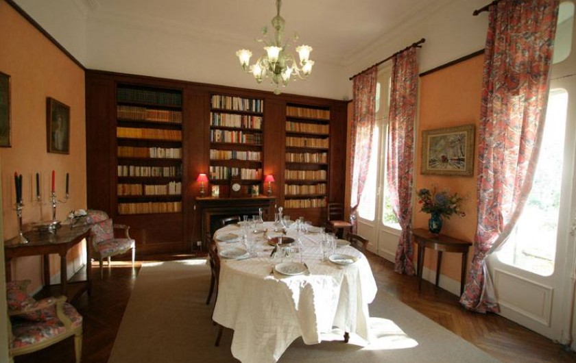 The dinning room and his bookcase