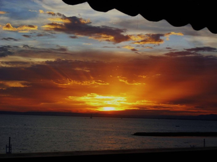 Location de vacances - Appartement à Le Grau-du-Roi - Coucher de soleil vu de la terrasse plein sud