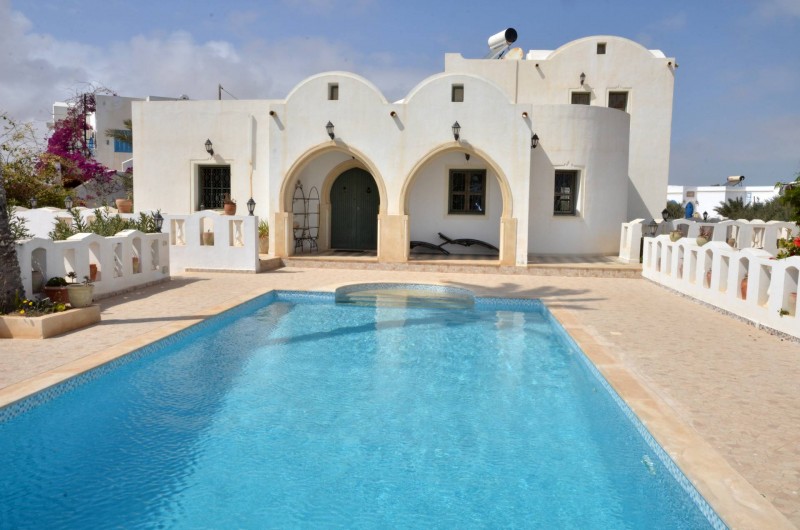 Location de vacances - Villa à Tezdaine - Façade piscine