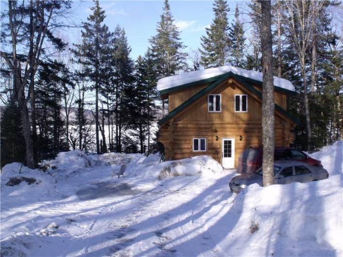Location de vacances - Chalet à Saint-Léonard-de-Portneuf - chalet bois rond hiver