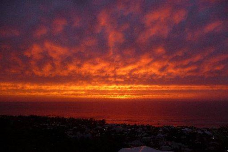 Location de vacances - Chalet à Saint-Leu - coucher de soleil vue de la veranda
