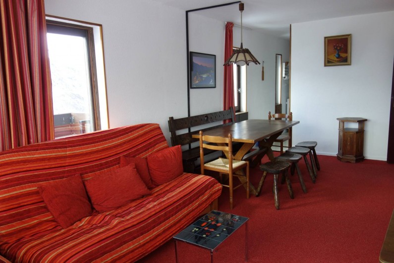 Location de vacances - Appartement à Les Menuires - Salon avec canapé clic clac